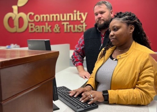 two tellers working in bank